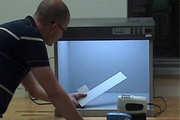 A Wisconsin Plastic Products employee tests color
