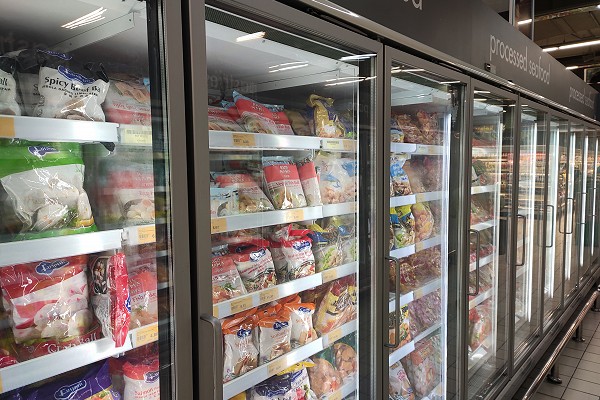 Photo of a freezer aisle. Wisconsin Plastic Products creates solutions for the commercial refrigeration industry.