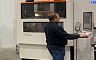 Employee creating streamlined extrusion die