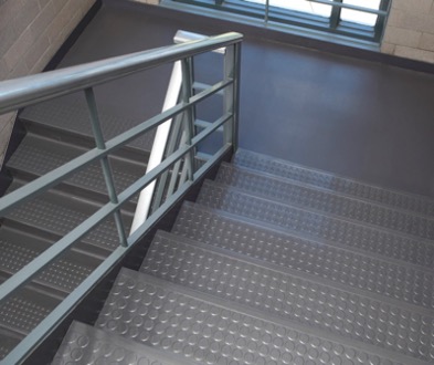A stairwell made with Wisconsin Plastic Products' embossed flooring